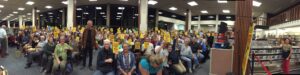 Carl Hiaasen stands among a large crowd of fans at the Sonoma County Public Library