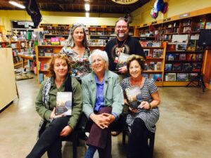 Mystery writer Laurie R. King appears at the San Rafael store flanked by booksellers.